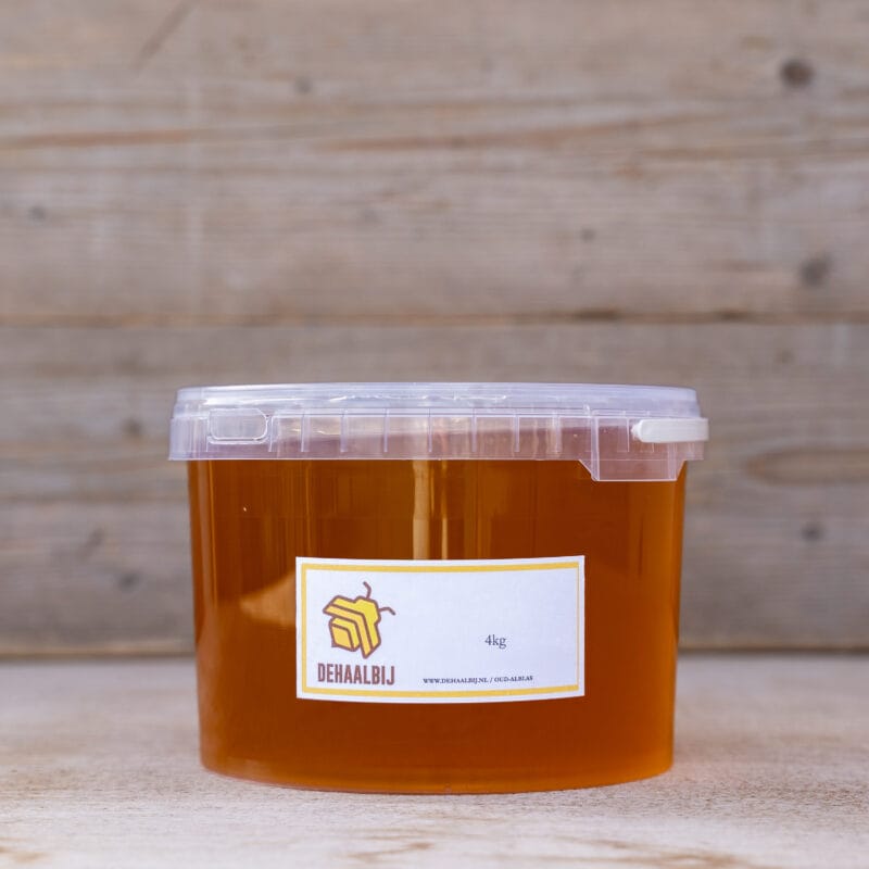 Rauwe imkerhoning honing in emmer