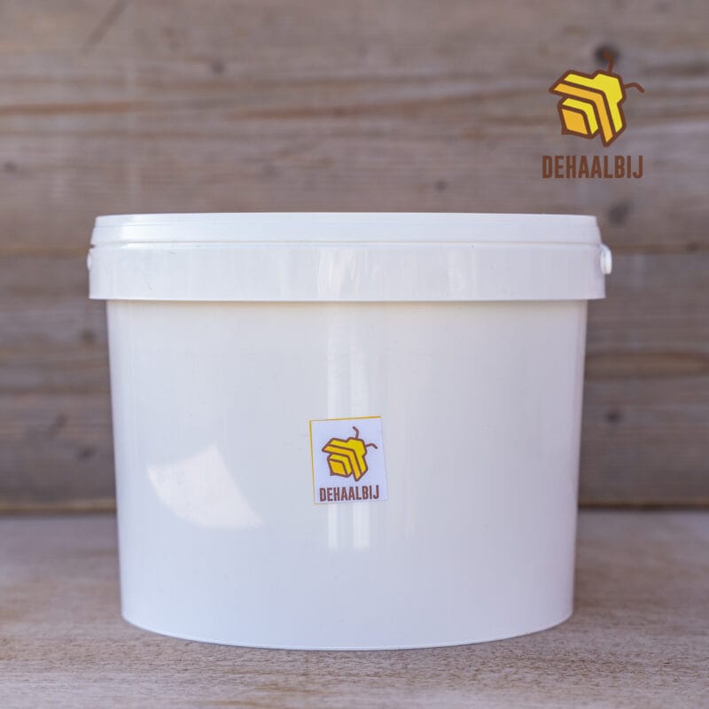 Rauwe imker honing honing in emmer